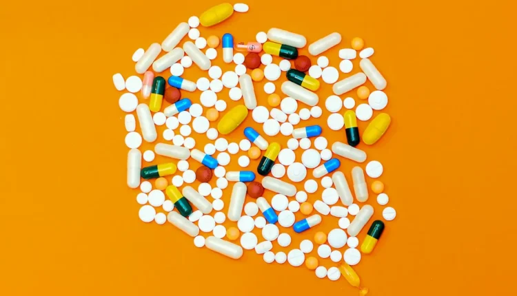 white and orange medication pill
