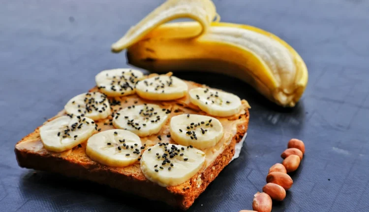 a piece of bread with bananas and nuts on it