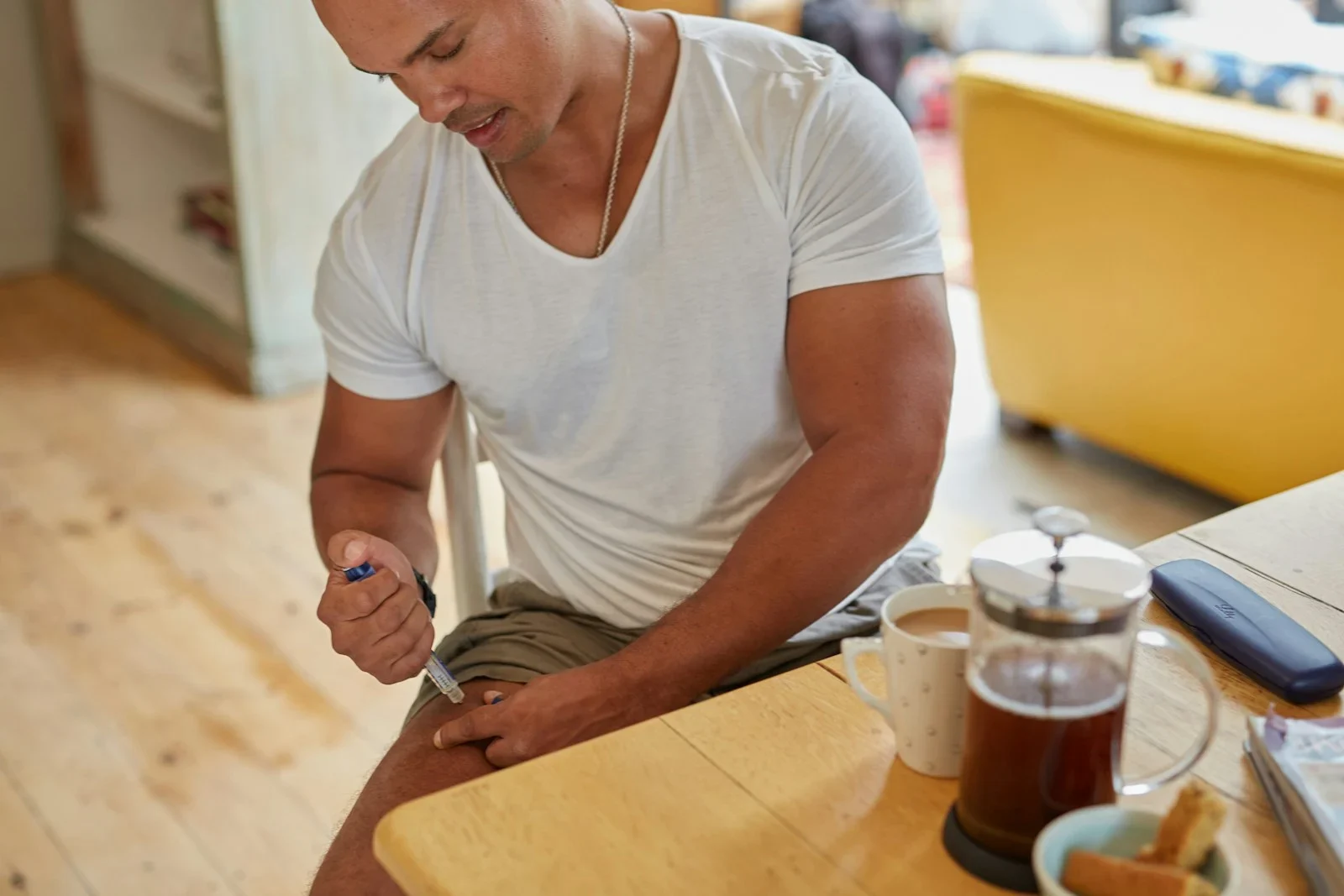 A man injects himself with medication