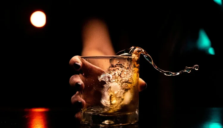 clear drinking glass with ice cubes
